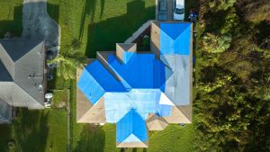 house with tarp on top