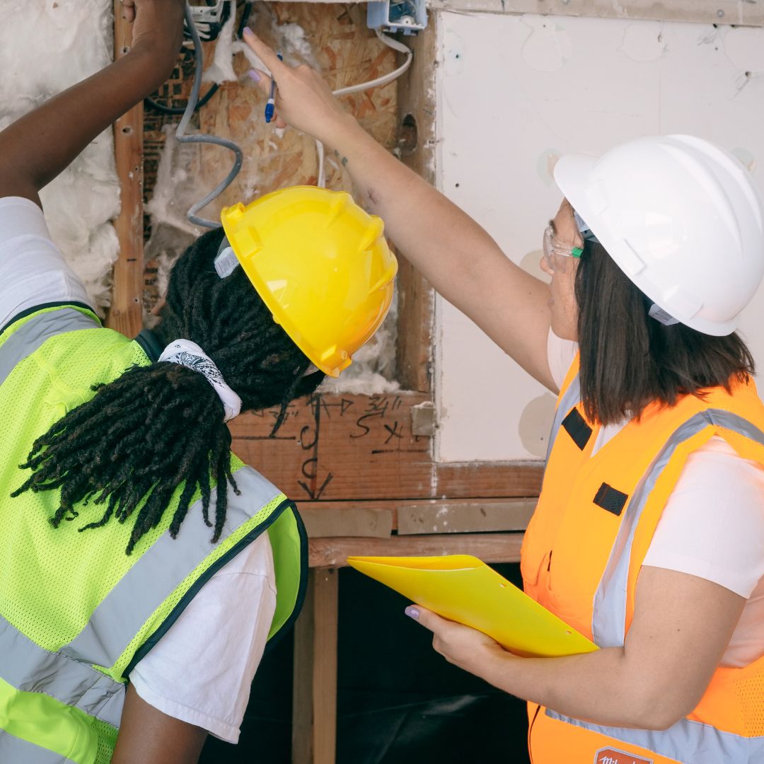 contractors inspecting walls