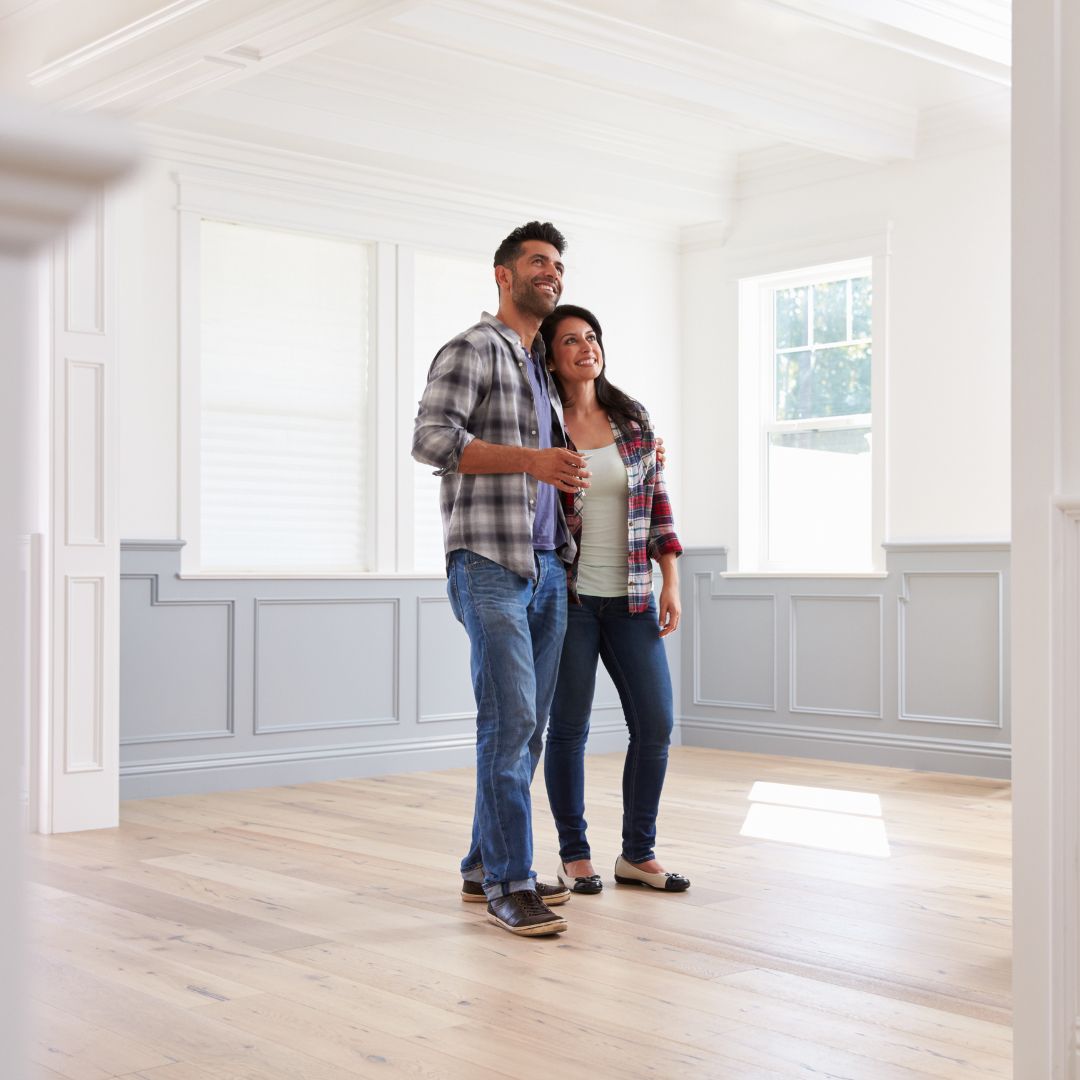 couple touring home smiling
